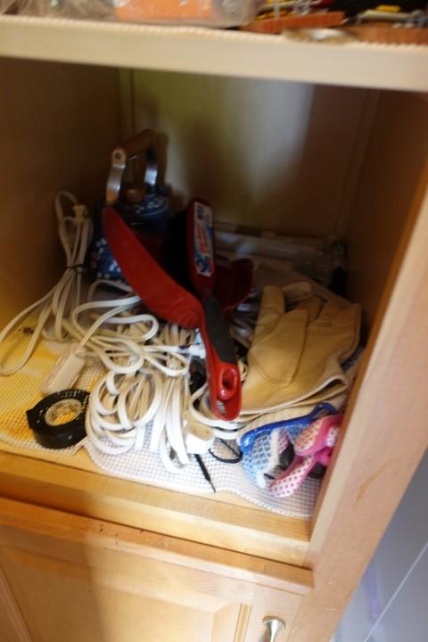 CONTENTS OF CABINET INCLUDING HARDWARE PICTURE HANGERS EXT CORDS WORK GLOVE