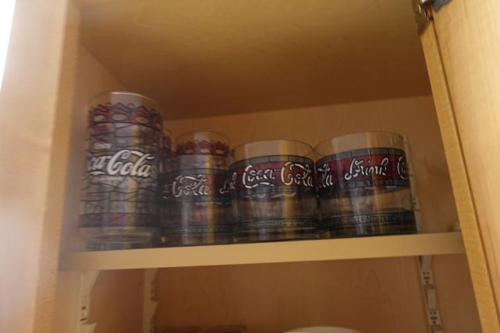 CONTENTS OF THREE CABINETS AND ONE DRAWER INCLUDING COCA COLA GLASSES COFFE