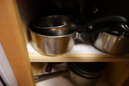 CONTENTS OF TWO DRAWERS AND TWO CABINETS FLATWARE LINENS POTS AND PANS