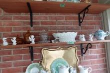 SHELF LOT INCLUDING COIN GLASS BISCUIT JARS ANGEL FIGURINES AND SUGAR BOWL