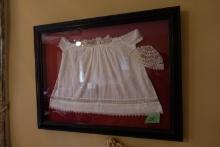 VINTAGE CHRISTENING DRESS AND HAT FRAMED UNDER GLASS APPROX 34 X 26