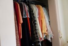 LARGE CLOSET FULL OF WOMENS VINTAGE CLOTHING AND HOLIDAY DECORATIVES