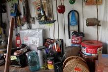 CONTENTS ON AND ABOVE WORK BENCH INCLUDING GARDEN SUPPLIES LUBRICANTS HARDW