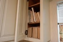 KITCHEN CABINET WITH COOKBOOKS INCLUDING MARY MARGARET MCBRIDE AND MORE