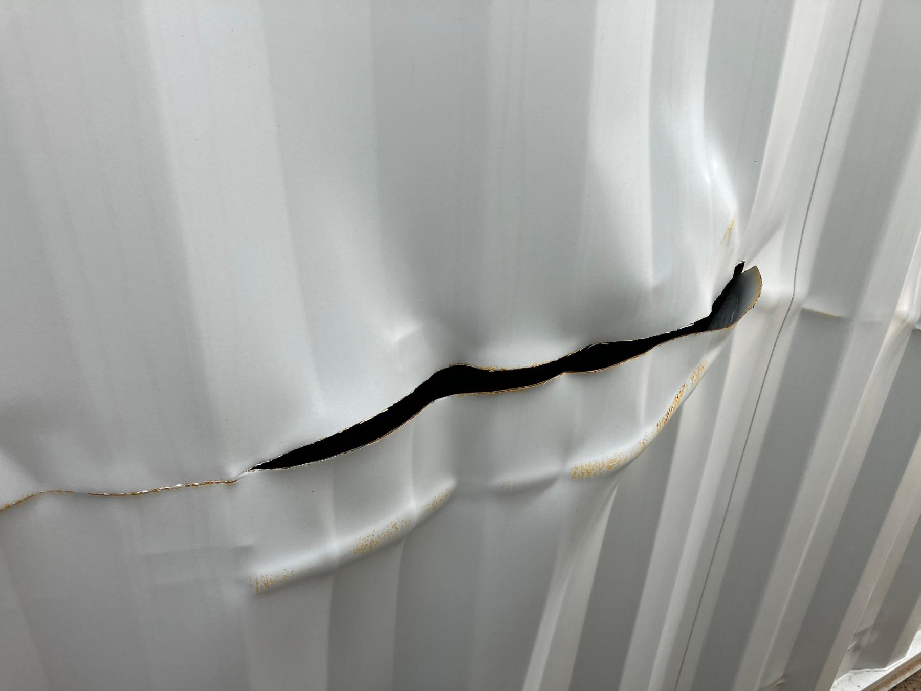40' CONTAINER W/ 2 SIDE DRS DAMAGED