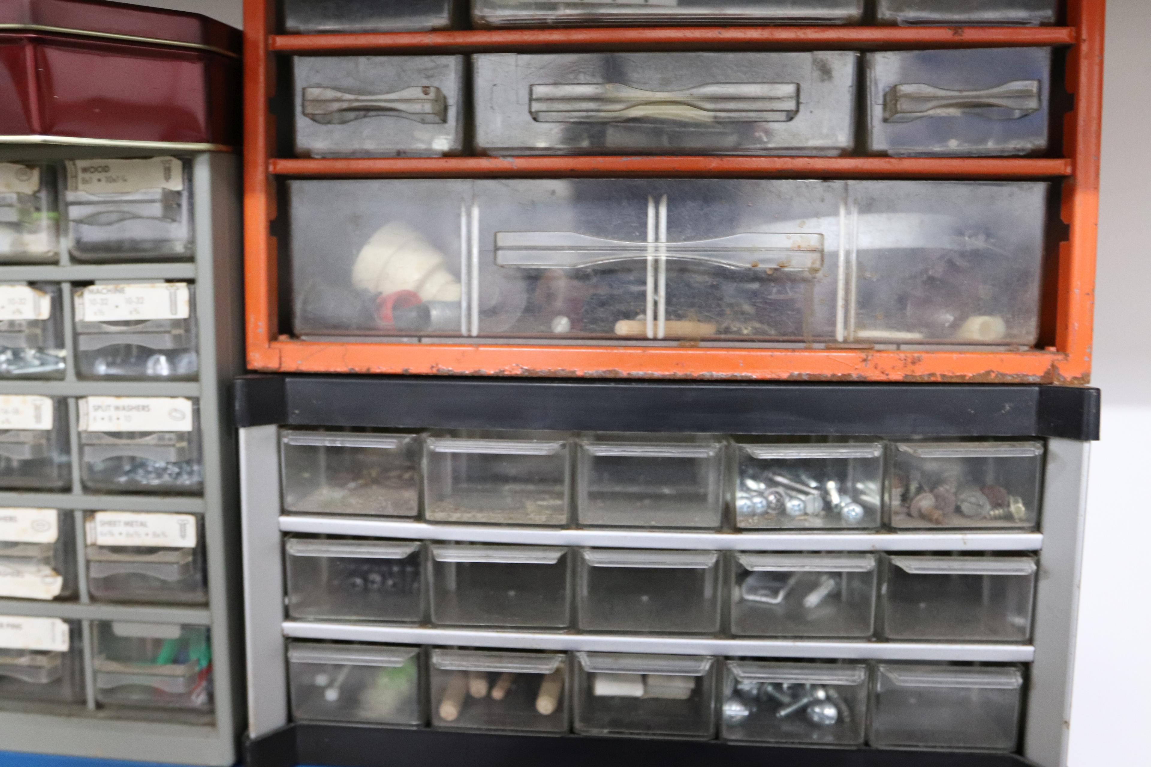 Five parts bins with contents including fasteners
