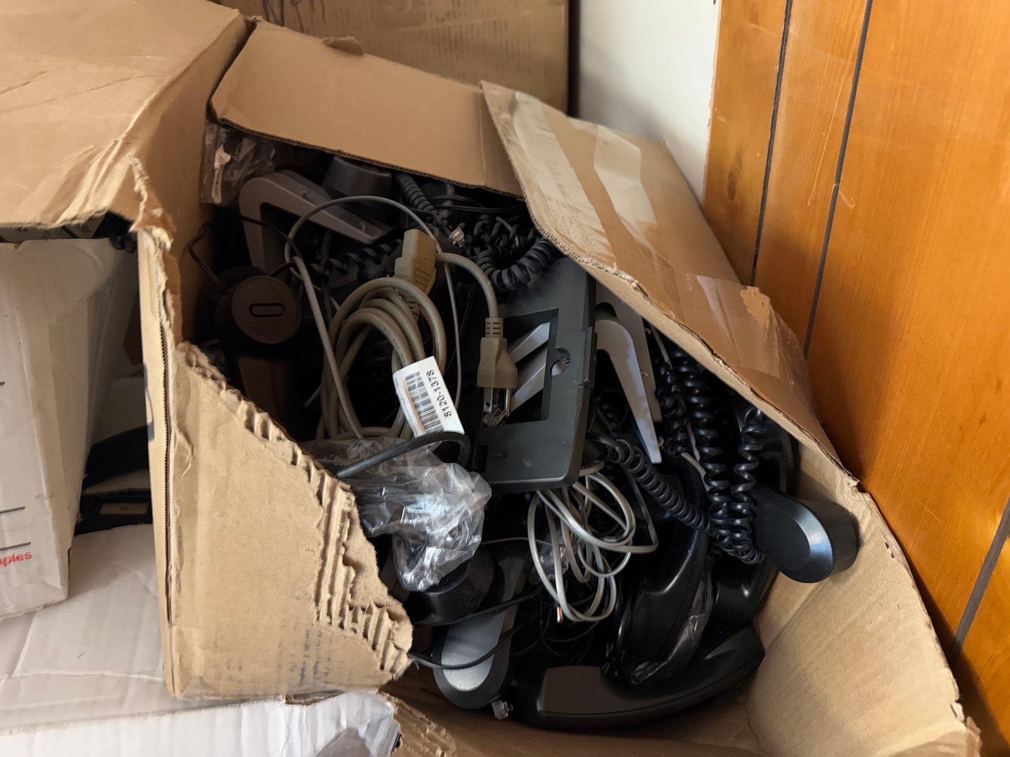 Group of Boxes w/ Desktop Office Phones, (1) Nortel Network Expansion Unit. OFFSITE: BROWNSVILLE,