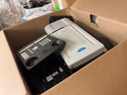 Group of Boxes w/ Desktop Office Phones, (1) Nortel Network Expansion Unit. OFFSITE: BROWNSVILLE,