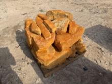 Group of Orange Stone Boulders on Pallet