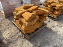 Group of Orange Stone Boulders on Pallet