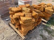 Group of Orange Stone Boulders on Pallet