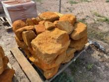 Group of Orange Stone Boulders on Pallet