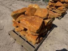 Group of Orange Stone Boulders on Pallet