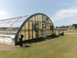 300' X 36' CAROLINA GREENHOUSE WITH HEATERS, FANS, AND A MOWER BOOM