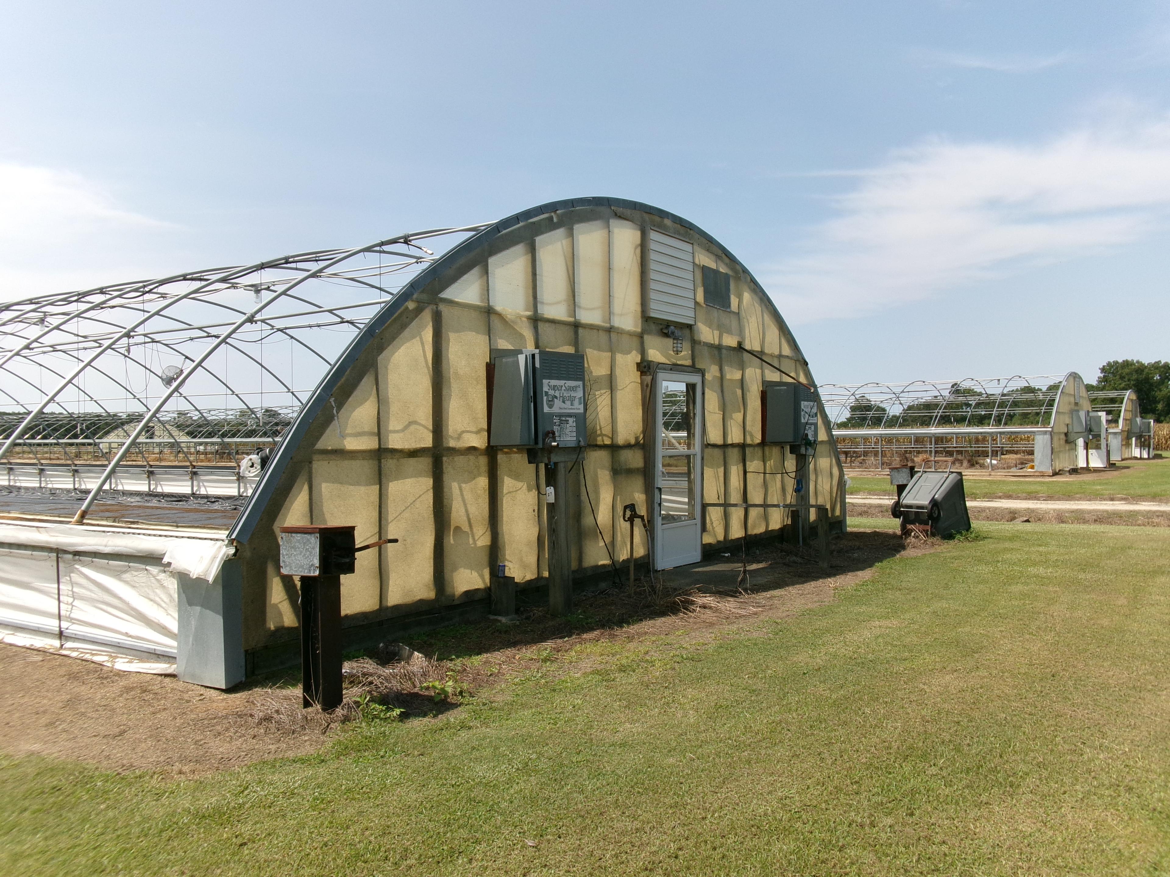 300' X 36' CAROLINA GREENHOUSE WITH HEATERS, FANS, AND A MOWER BOOM