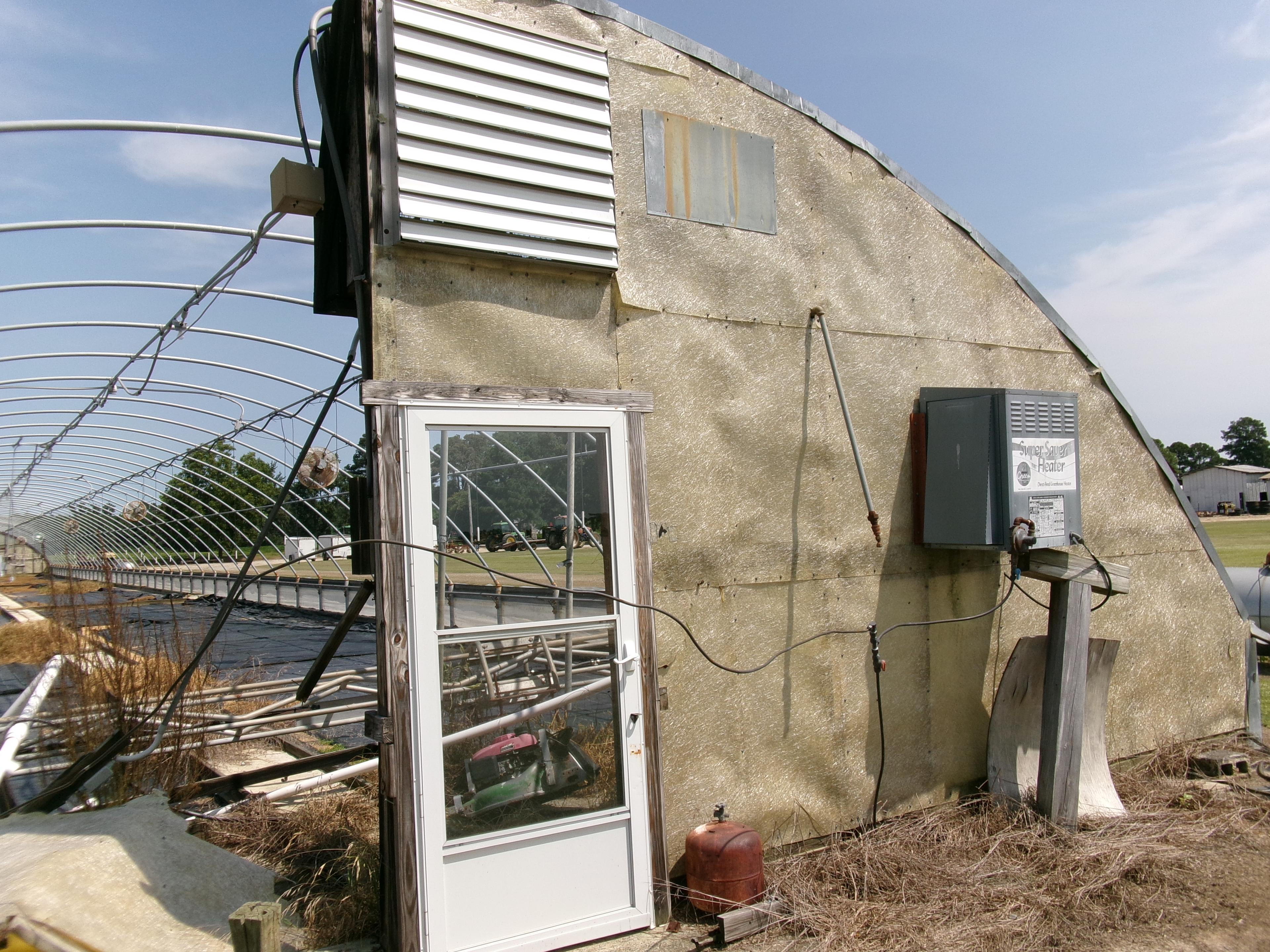 300' X 36' CAROLINA GREENHOUSE WITH HEATERS, FANS, AND A MOWER BOOM