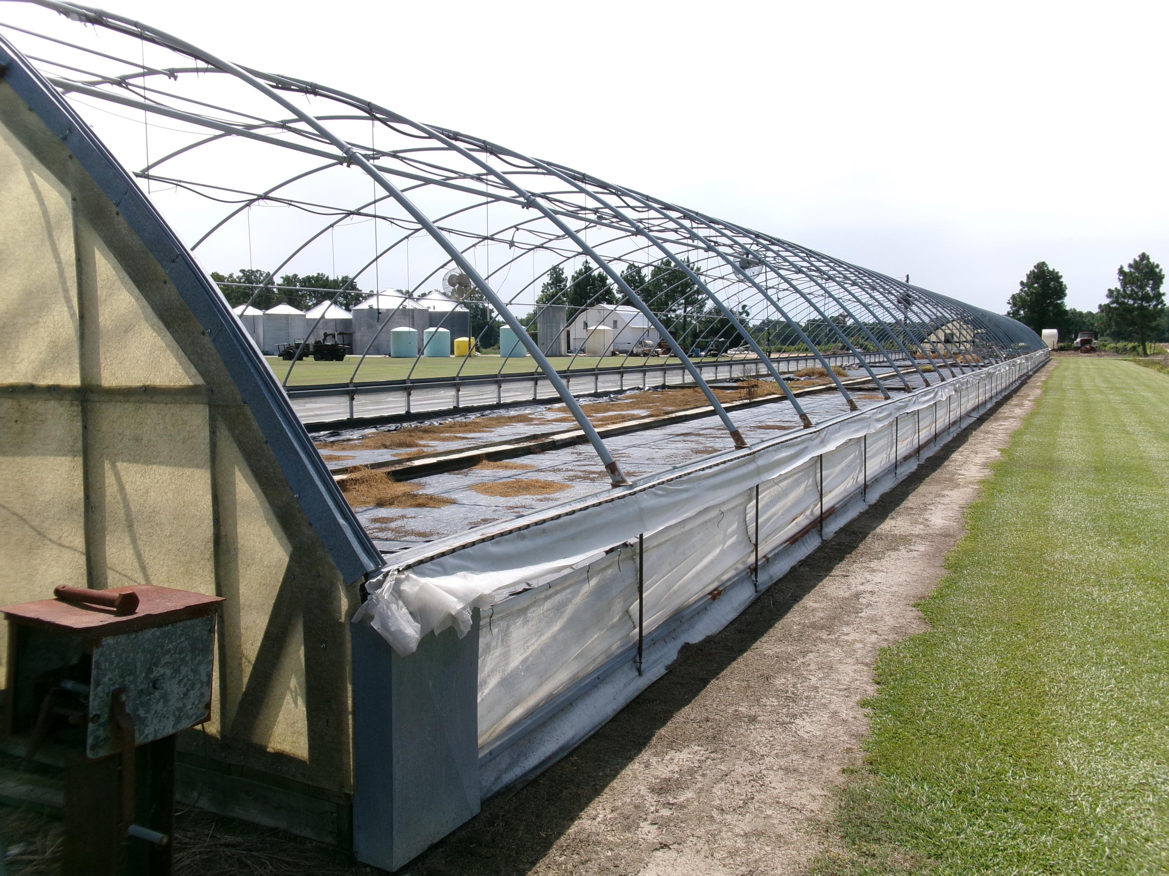 300' X 36' CAROLINA GREENHOUSE WITH HEATERS, FANS, AND A MOWER BOOM