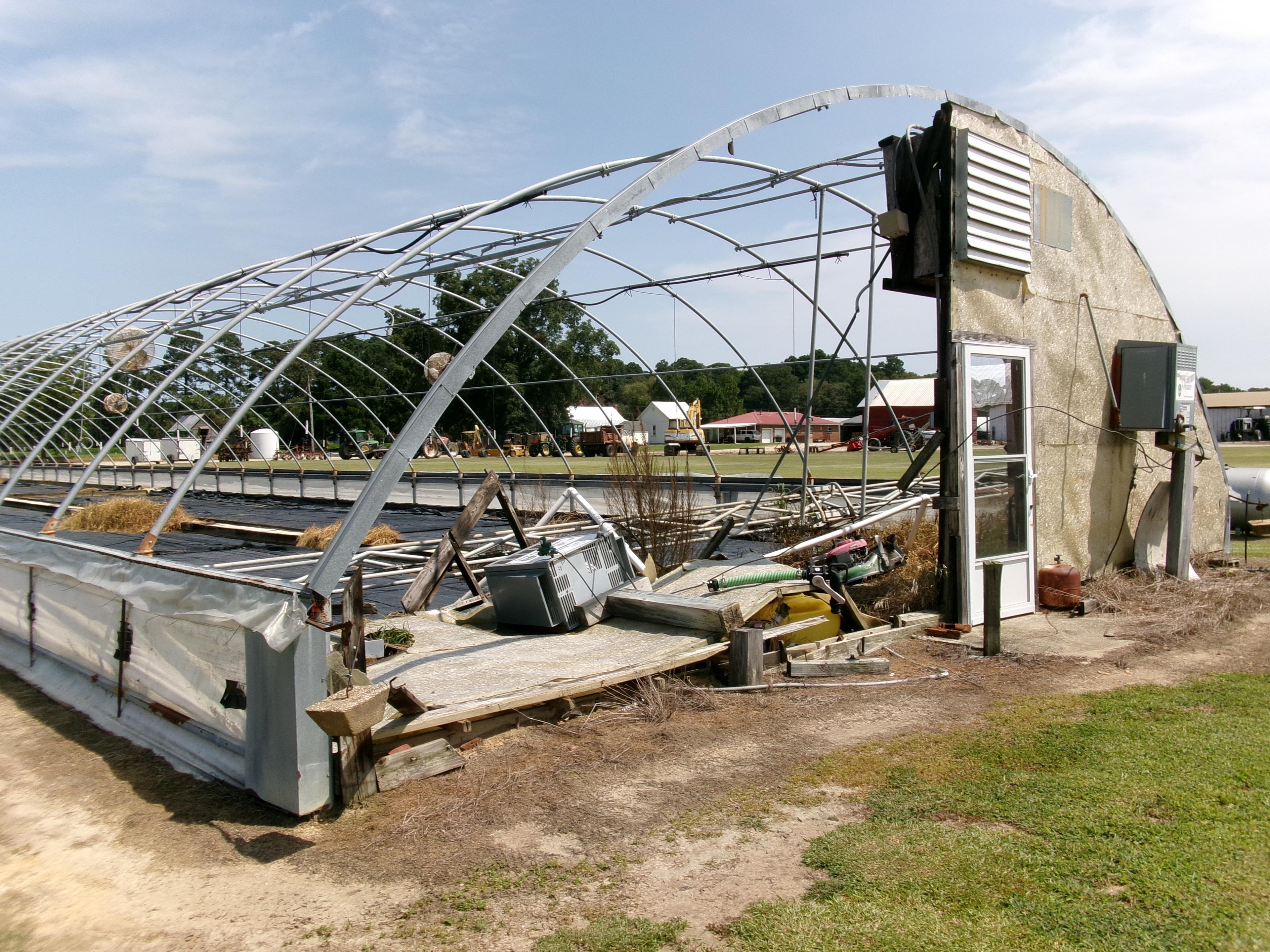 300' X 36' CAROLINA GREENHOUSE WITH HEATERS, FANS, AND A MOWER BOOM