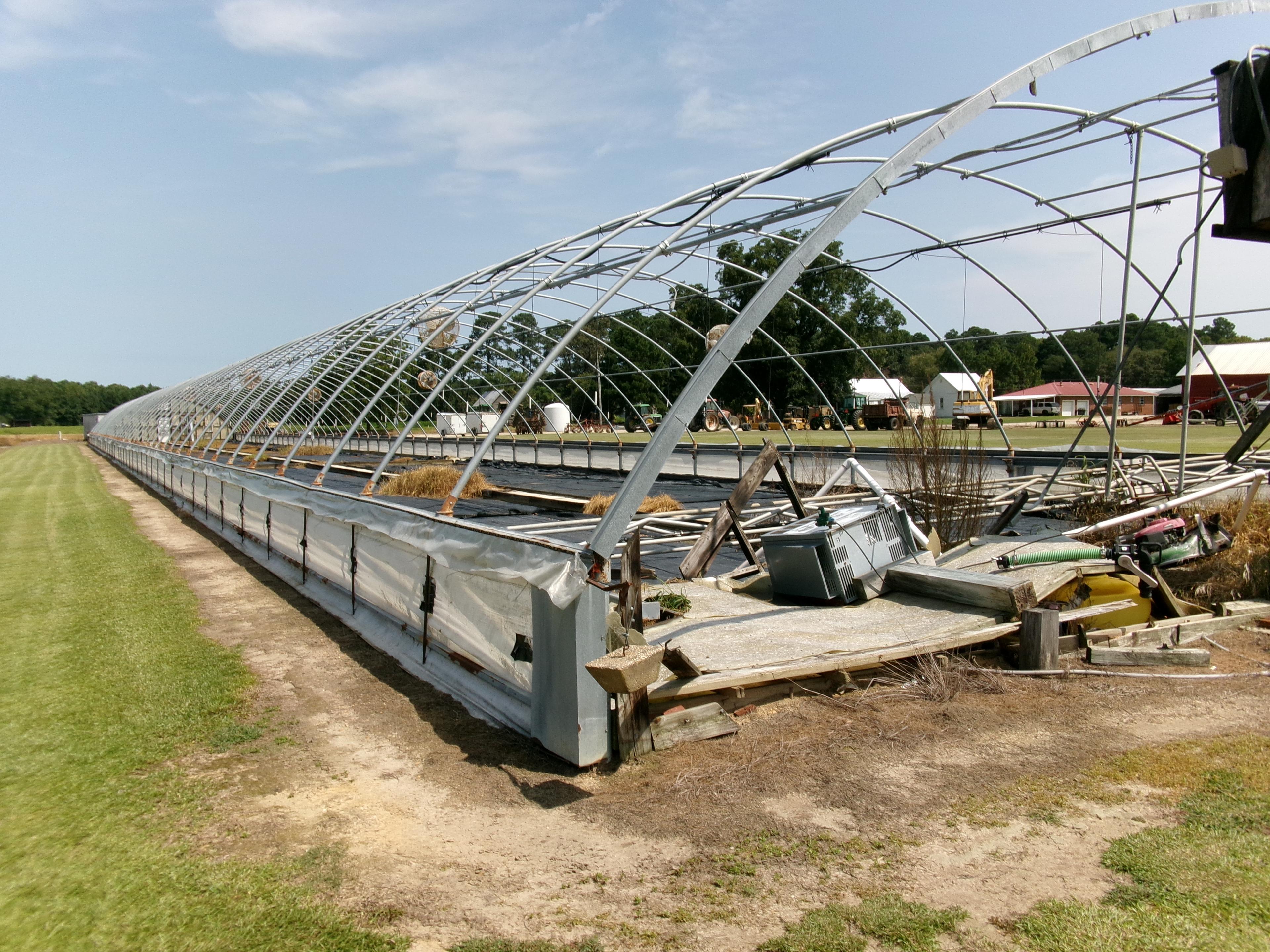 300' X 36' CAROLINA GREENHOUSE WITH HEATERS, FANS, AND A MOWER BOOM