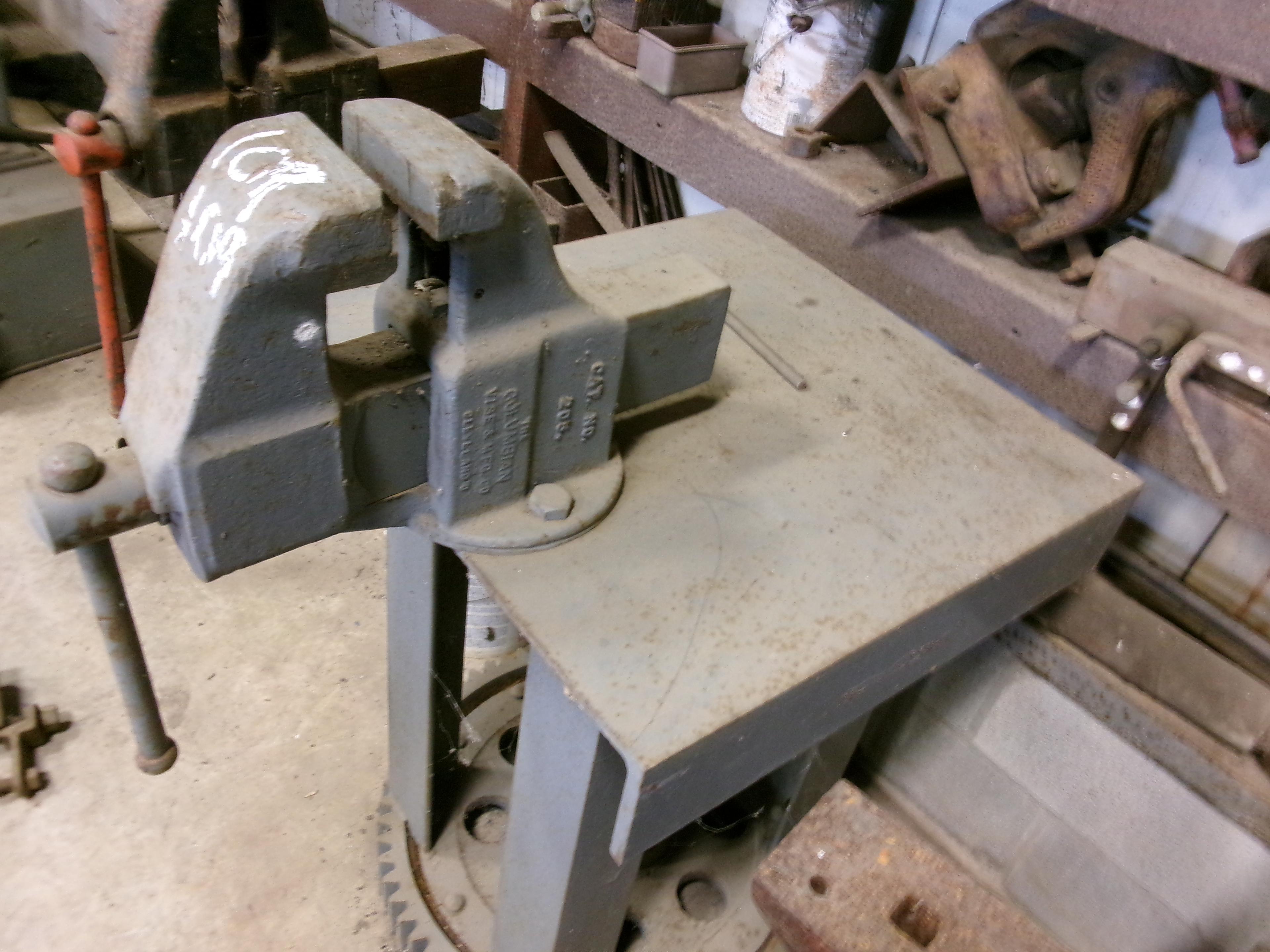 VISE ON STEEL TABLE