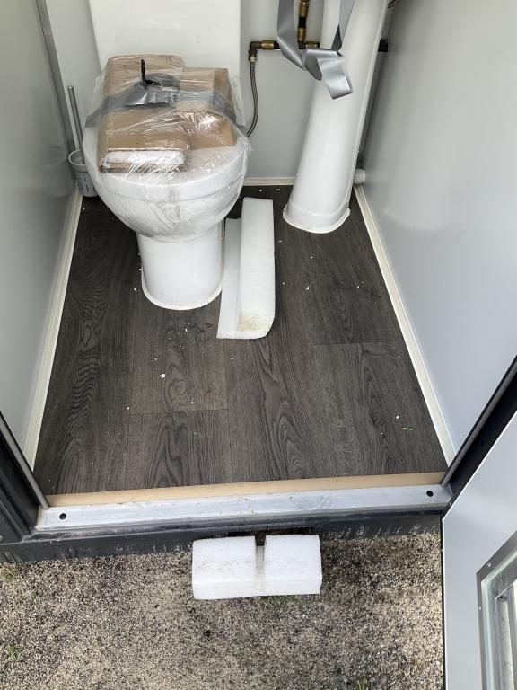 (1086)UNUSED PORTABLE TWO STALL TOILET