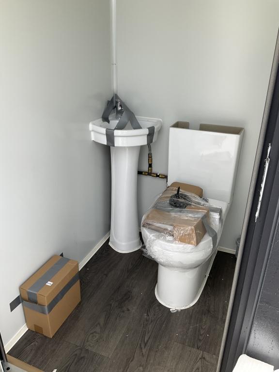 (1086)UNUSED PORTABLE TWO STALL TOILET