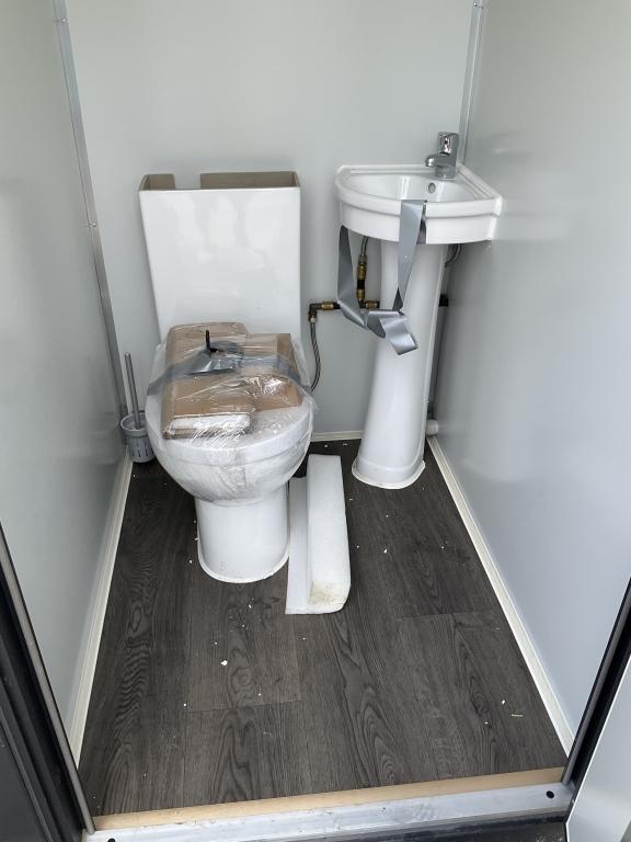 (1086)UNUSED PORTABLE TWO STALL TOILET