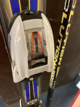 Pair of Logic skis one Traverse mountain ski and a hockey stick