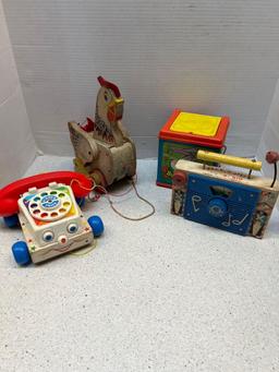 Four vintage toys Mattel Bugs Bunny music box Fisher Price chicken clock and radio