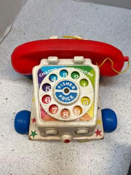 Four vintage toys Mattel Bugs Bunny music box Fisher Price chicken clock and radio
