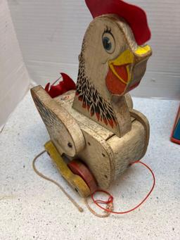 Four vintage toys Mattel Bugs Bunny music box Fisher Price chicken clock and radio