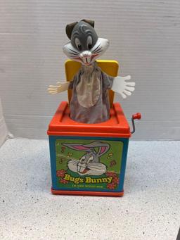 Four vintage toys Mattel Bugs Bunny music box Fisher Price chicken clock and radio