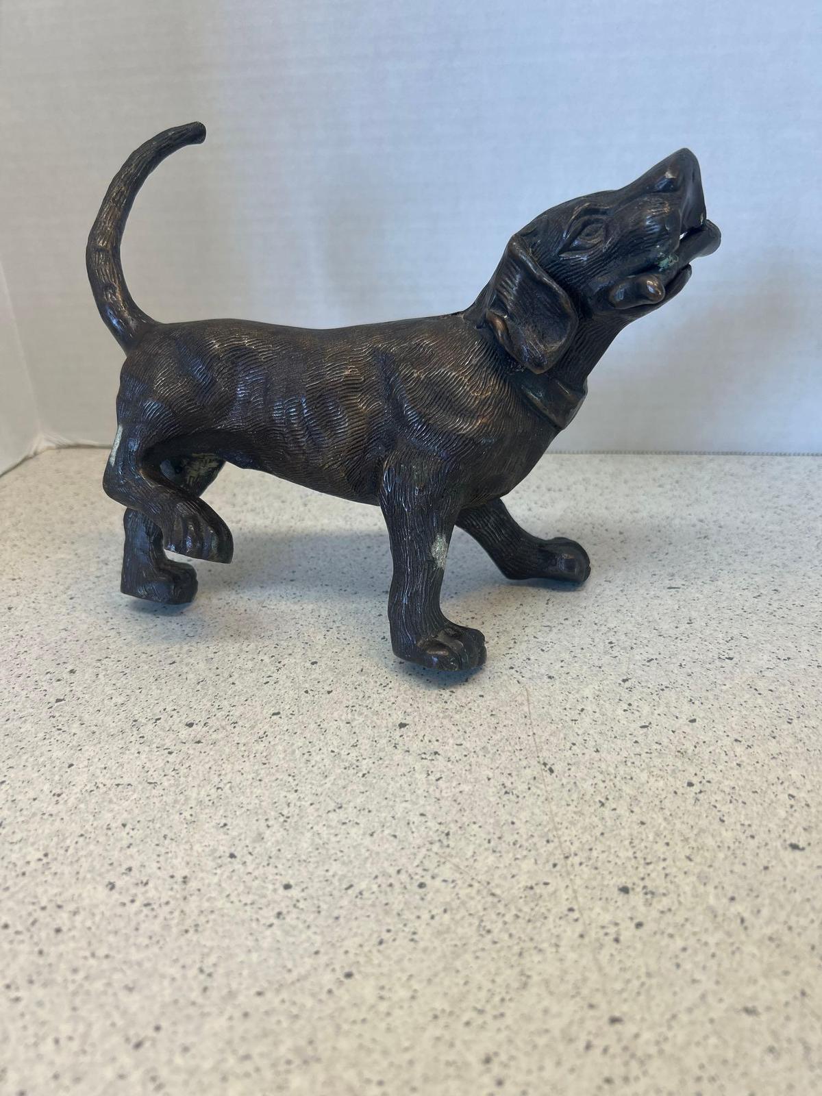 Bronze sculpture dog with bone