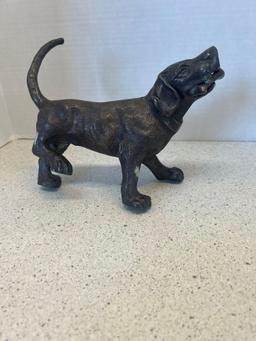 Bronze sculpture dog with bone