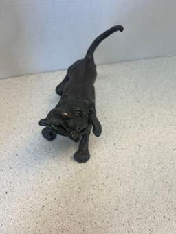 Bronze sculpture dog with bone