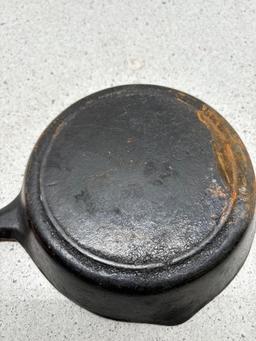 vintage number three cast-iron skillet with smoke ring