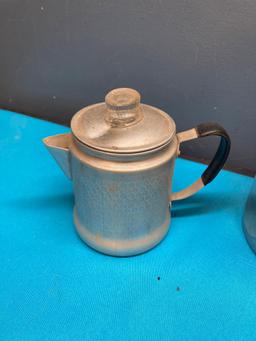 Vintage coffee pots, granite, and enamel cups and an old creamer