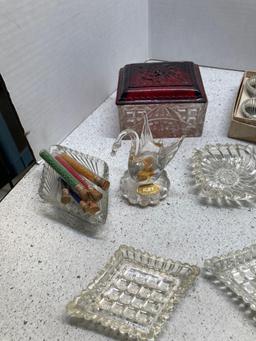 Glassware, trinket dishes, saltcellars, salt and pepper, and a vase