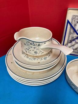 Partial temperware dishes, royal Copenhagen candles and napkins, blue Delft, and two cubist glasses