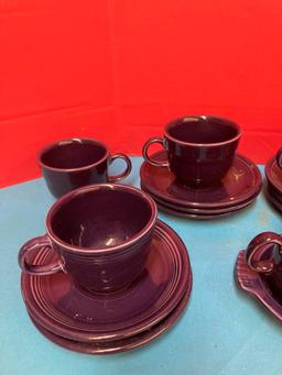 Nice lot of purple fiestaware cups and saucers, cream and sugar