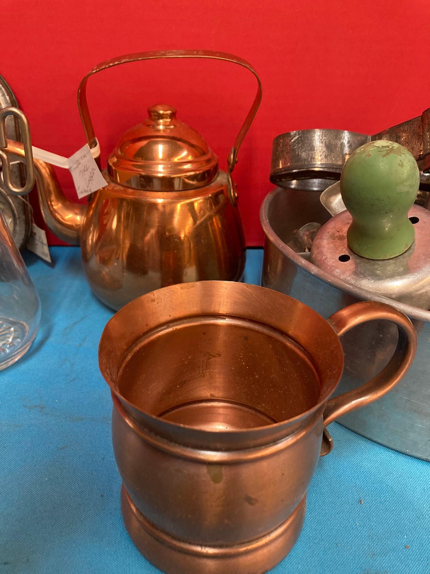 Vintage kitchen items, cookie cutters, molds, copper tea kettle, and more