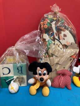 Plush Minnie, Mickey, and goofy dolls