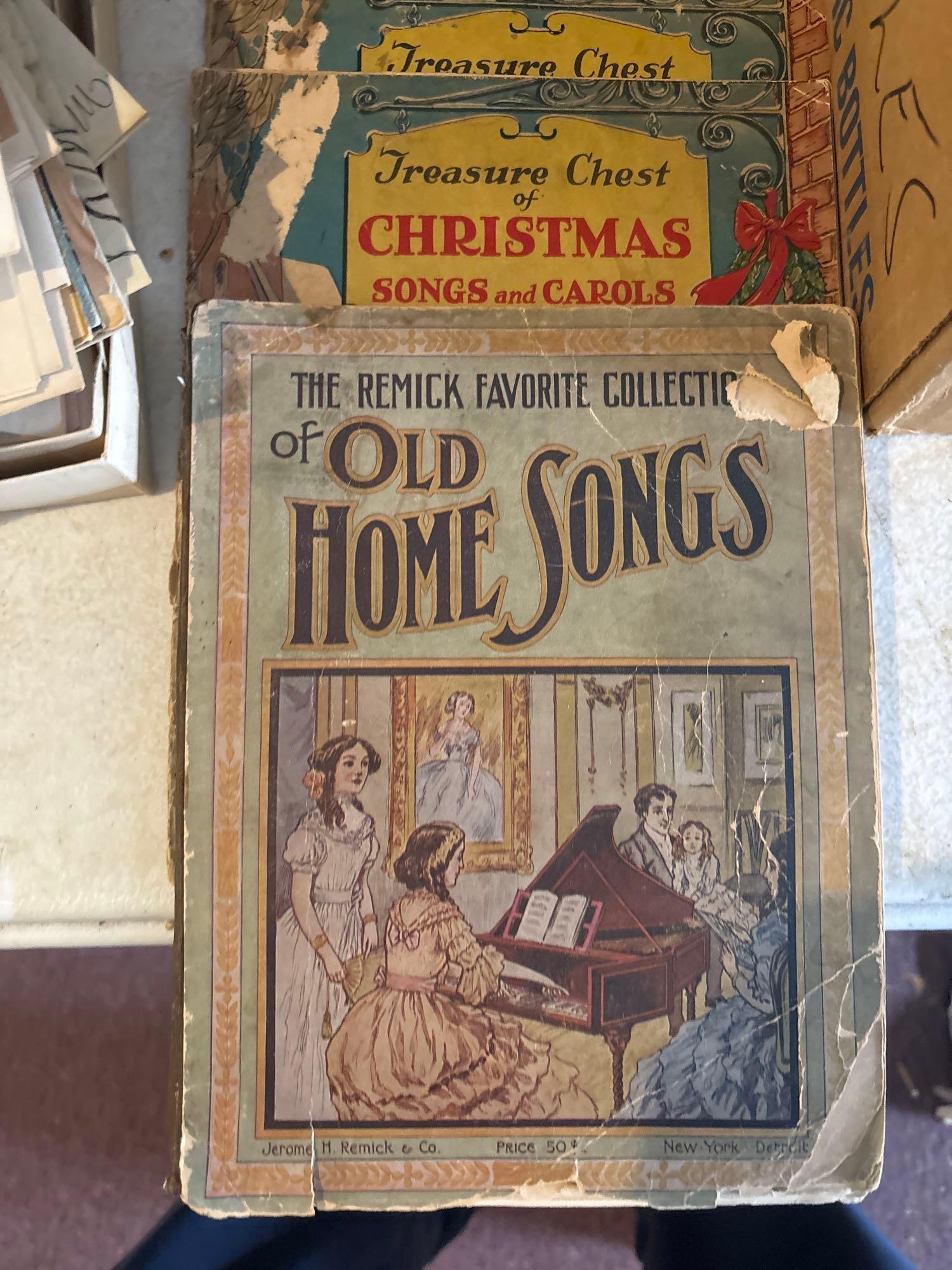 large box of vintage newspapers old greeting cards music books books in magazine holder