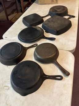 seven cast iron pans