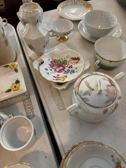 large collection of porcelain cup saucers vases etc.