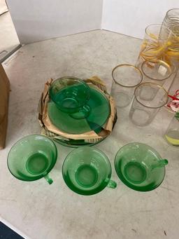 Vintage green glass snacker set in original box, Also vintage drinking glasses mid century Santa