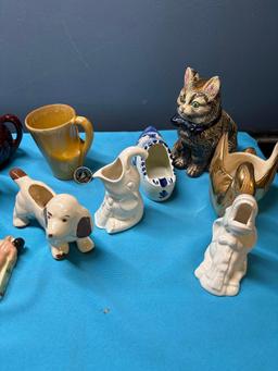 Collection of pottery animals pots etc.