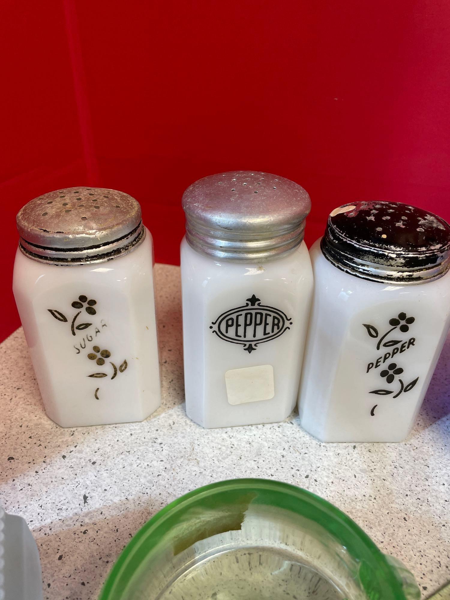 Vintage milk glass sugar, pepper shakers, blue glassware, green glassware, and hobnail ashtrays