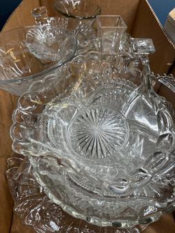 A lot of glass platters cake plates candlesticks dishes sugar bowls etc.