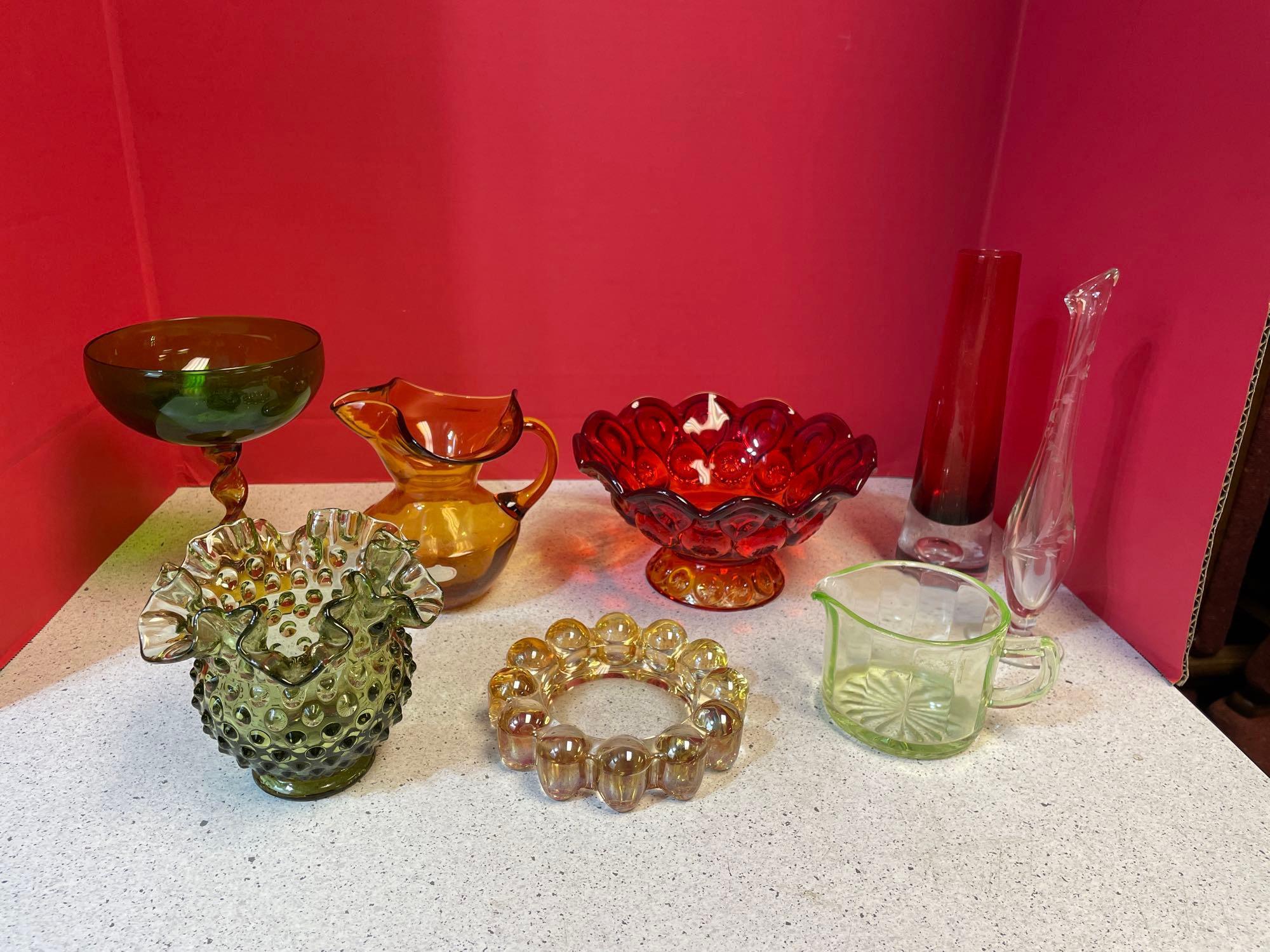 Colorful glassware, including Amberina, LE Smith, moon and stars, green hobnail and Amber vase and